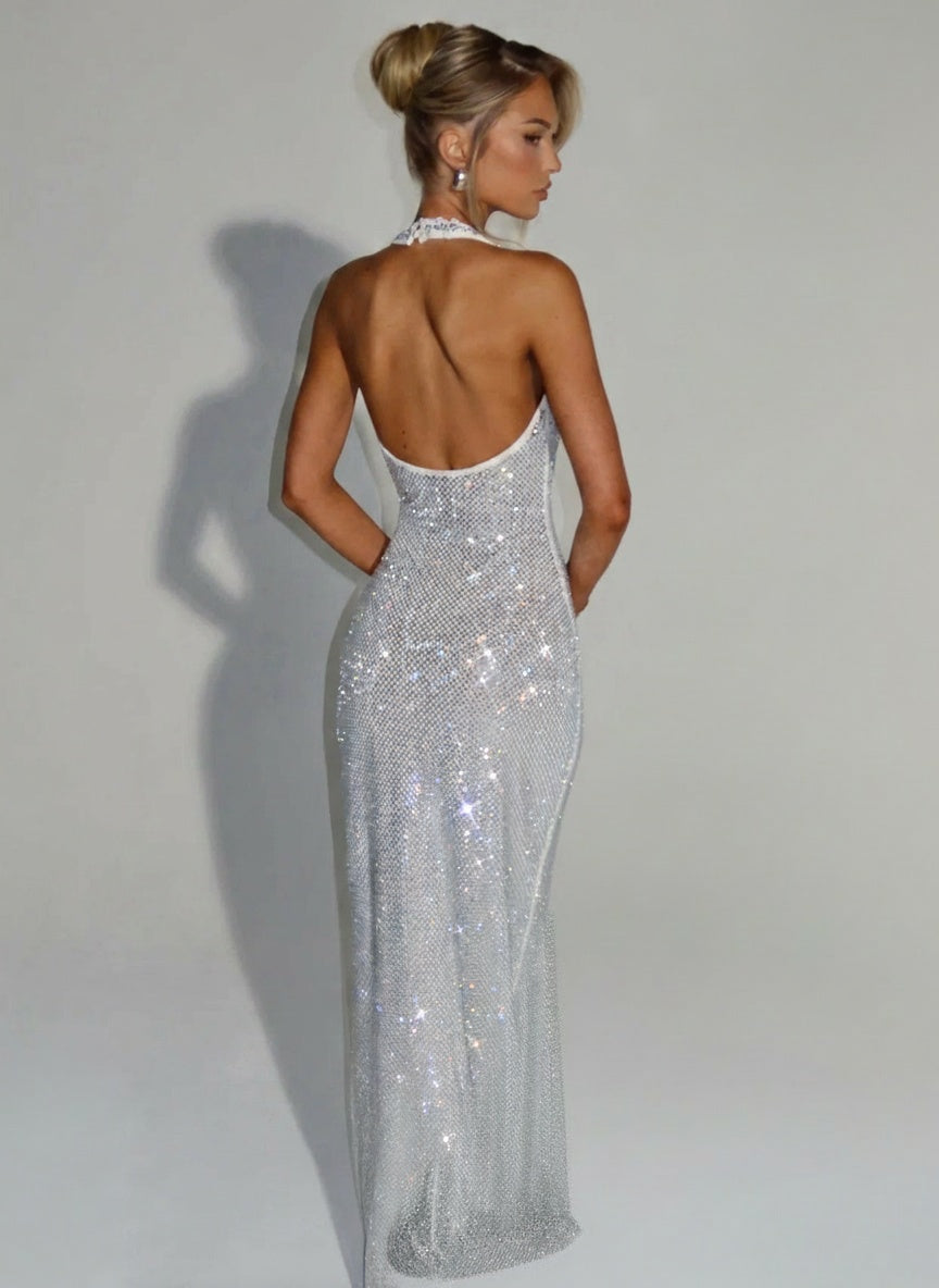Back pose of the model wearing Elegant Sequins Backless Waist Trimming Hip Skirt