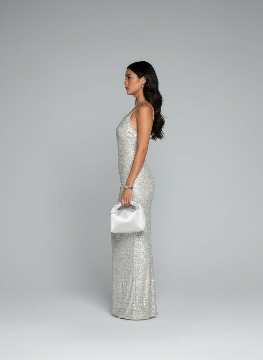 Side profile of the model wearing Sexy Backless Mesh Stitching Socialite Temperament Slim Dress