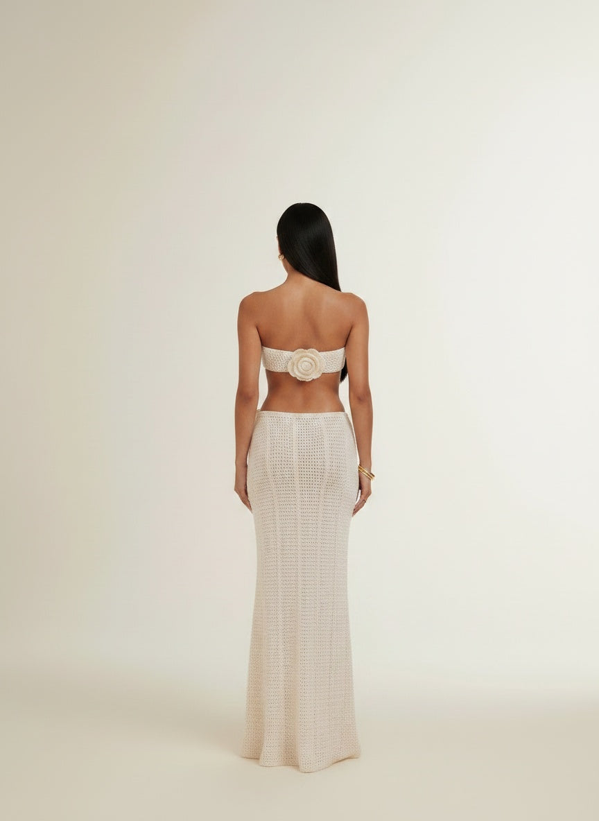 Back pose of the model wearing Women's Solid Color Knitted Crocheted Beach Bikini Swimsuit Blouse Sun-proof Set